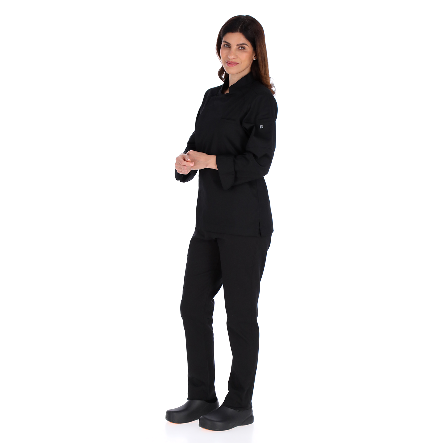 Model side view of Unser black chef jacket showing ergonomic fit and refined style for professional culinary apparel